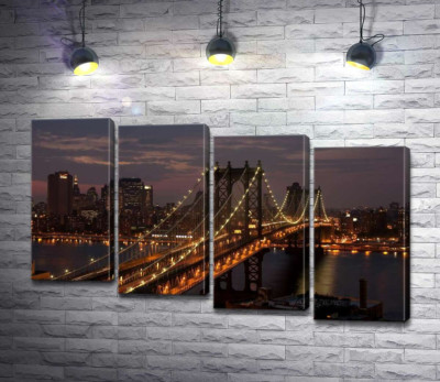 Огни Бруклинского моста (The Brooklyn Bridge) освещают ночную дорогу