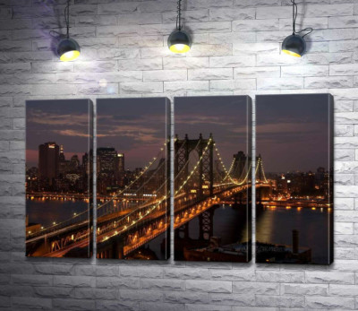 Вогні Бруклінського мосту (The Brooklyn Bridge) освічують нічну дорогу