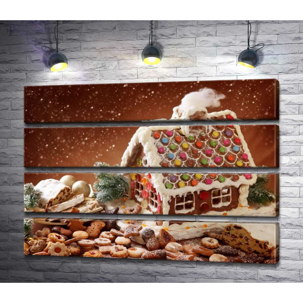 Пряничный домик с глазурью в окружении праздничного печенья