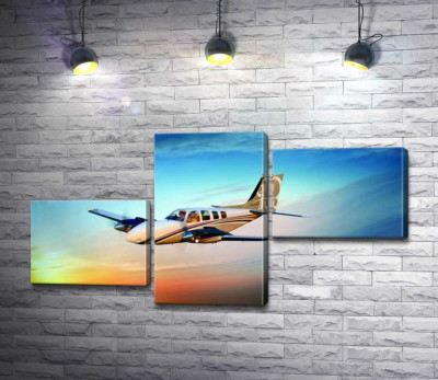 Модульна картина "Американський літак Beechcraft Bonanza серед палаючого заходу"