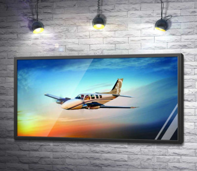 Постер "Американський літак Beechcraft Bonanza серед палаючого заходу"
