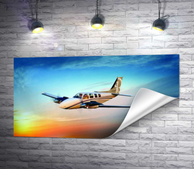 Американський літак Beechcraft Bonanza серед палаючого заходу