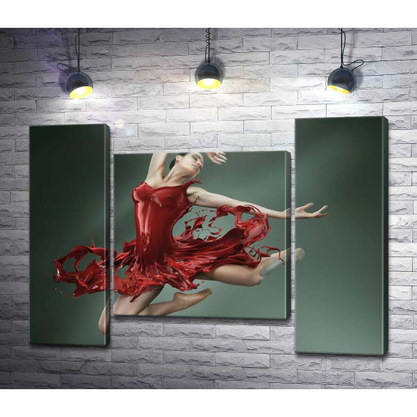 Ніжна балерина граційно летить в соковито-червоній сукні
