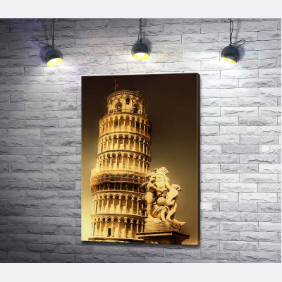 Пізанська вежа (Pisa tower) видніється через фонтан Путті (Fontana dei Putti)