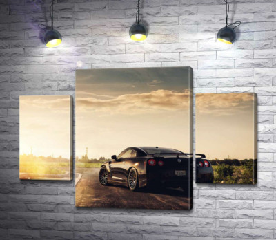 Модульная картина "Лучи сверкают золотом на черной поверхности автомобиля Opel"