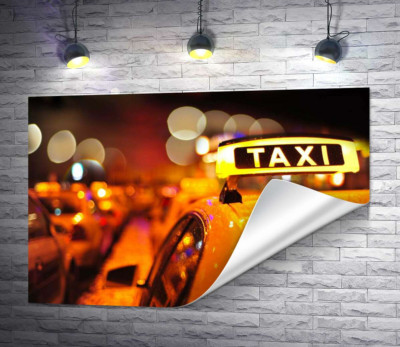 Жовтий маячок "Taxi" на даху автомобіля