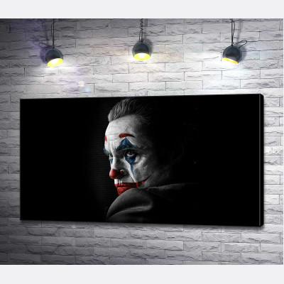 Сумний погляд Джокера (Joker) з тіні