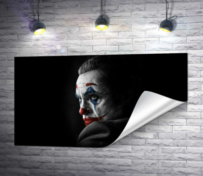 Сумний погляд Джокера (Joker) з тіні
