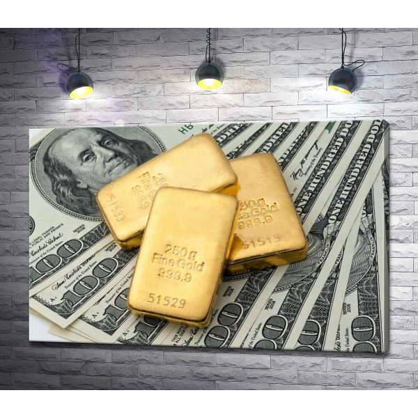 Золотые слитки сверкают на долларовых купюрах