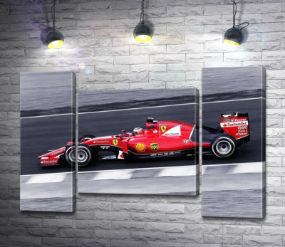 Червоний автомобіль Ferrari на гоночній трасі "Формули-1"