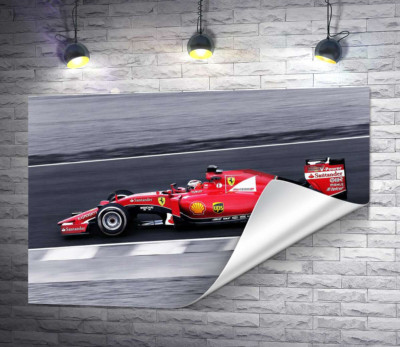 Красный автомобиль Ferrari на гоночной трассе "Формулы-1"
