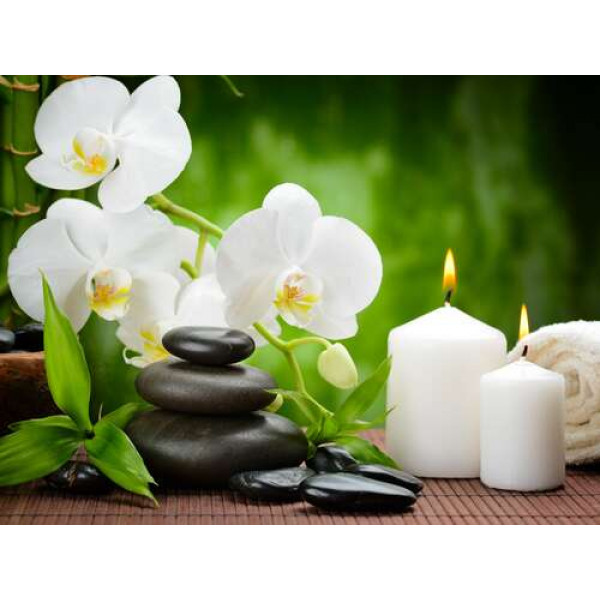Відпочинок у спа салоні серед орхідей, свічок та каміння