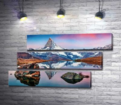 Гористий пік гори Матергорн (Matterhorn) відбивається у тихих водах озера