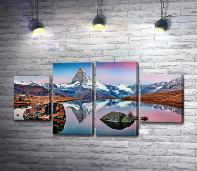 Гористий пік гори Матергорн (Matterhorn) відбивається у тихих водах озера