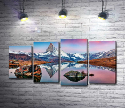 Гористый пик горы Маттерхорн (Matterhorn) отражается в тихих водах озера