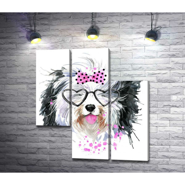Чорно-біла собака в окулярах та з бантиком