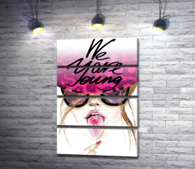 Девушка с леденцом в розовой шляпе с надписью "we are young"