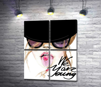 Девушка с леденцом в черной шляпе с надписью "we are young"