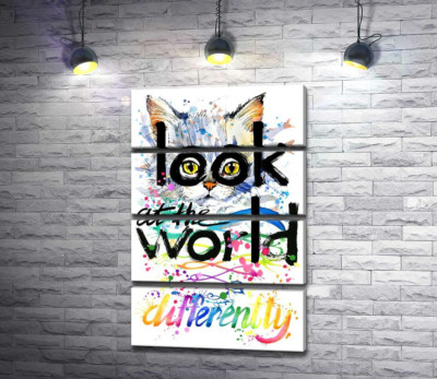 Жовті очі кота виглядають з-за напису "look at the world differently"