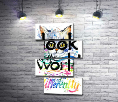 Жовті очі кота виглядають з-за напису "look at the world differently"
