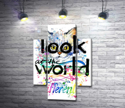 Желтые глаза кота выглядывают из-за надписи "look at the world differently"