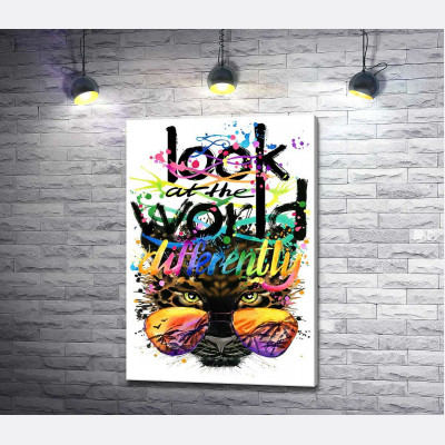 Напис "look at the world differently" на фоні леопарда в окулярах