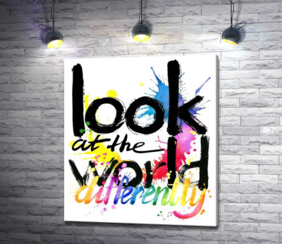 Напис "look at the world differently" на фоні кольорових плям фарби