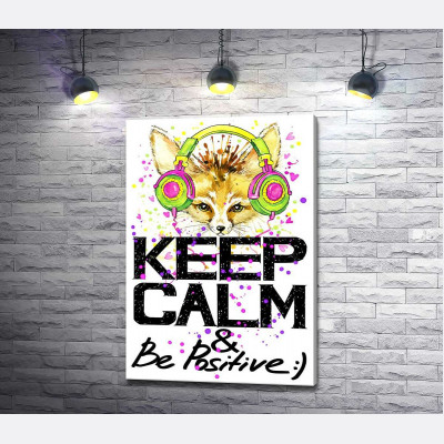 Лиса фенек в ярких наушниках над надписью "keep calm and be positive"