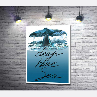 Кит пірнає у блакитні води океану з написом "deep blue sea"