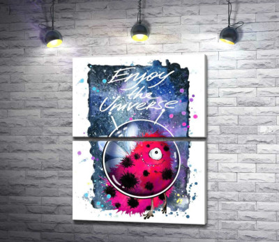 Красный монстр с крылышками среди космоса с надписью "Enjoy the Universe"