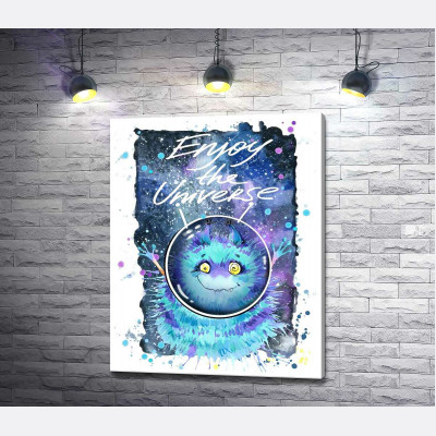 Монстр з блакитною шерстю літає в космосі з написом "Enjoy the Universe"