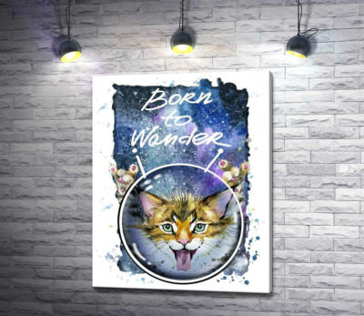 Руде кошеня в шоломі серед космосу з написом "born to wander"
