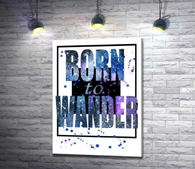Космічний напис у синіх тонах "born to wander"