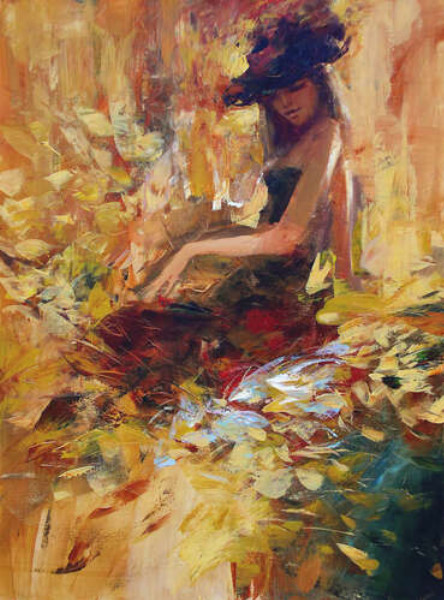 Девушка в красной шляпе сидит среди осенних листьев