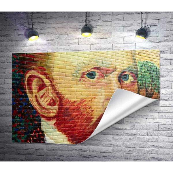 Портрет Вінсента Ван Гога виблискує фарбами на стіні