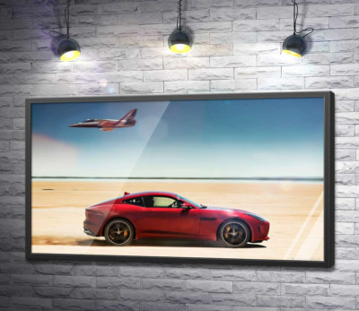 Постер "Червоний автомобіль Jaguar F-Type R розминувся з літаком серед пустелі"