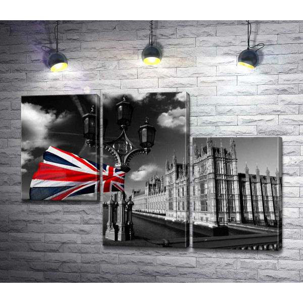 Британський прапор тріпотить на вітрі над глибоководною Темзою 