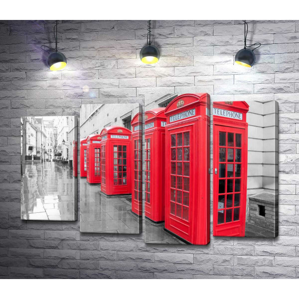 Яскраві телефонні будки вишикувались в ряд під стіною старого лондонського будинку