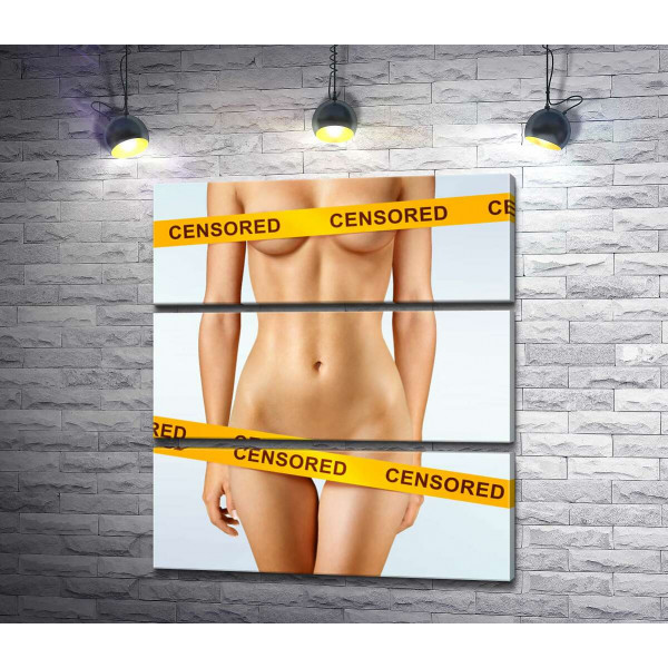 Інтимні зони звабливого жіночого тіла прикриті жовтою стрічкою "censored"