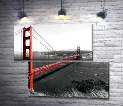 Яскравий міст "Золоті ворота" (Golden Gate Bridge) прокладений над темними водами протоки