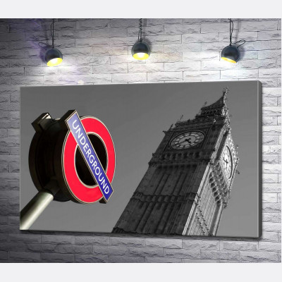 Значок входу у метро біля стрункої вежі Біг Бена (Big Ben)