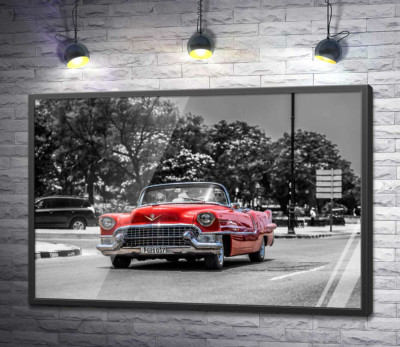 Постер "Червоний Cadillac Eldorado їде широкою міською дорогою"