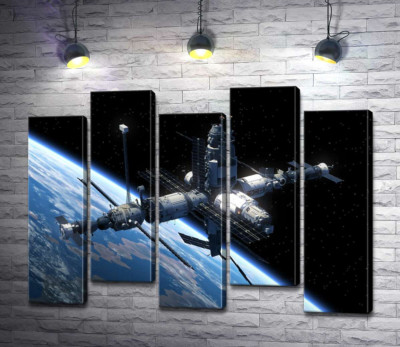 Модульная картина "Космическая станция летит по земной орбите"