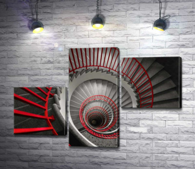 Червоні перила яскравим акцентом обрамляють сірі сходи