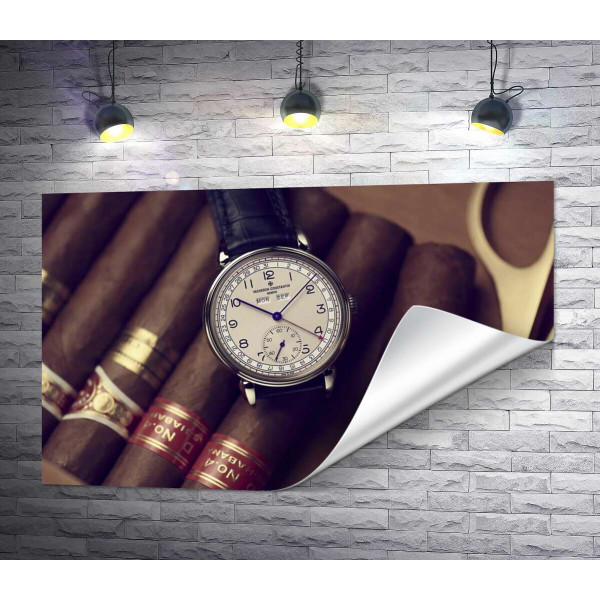 Элитные часы Vacheron-Constantin лежат на сигарах