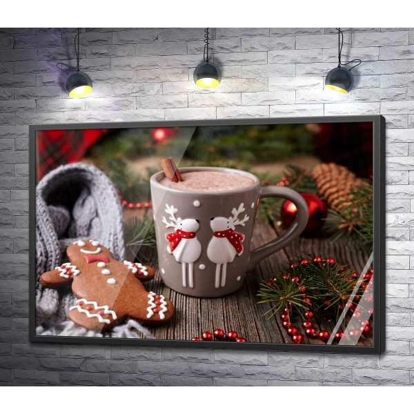 Веселые олени на чашке какао рядом с пряничным человечком