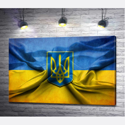 Герб Украины на желто-голубых складках флага