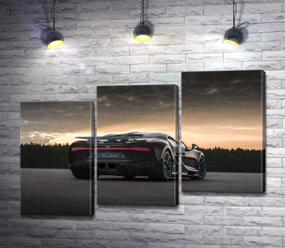 Темный силуэт черного спортивного автомобиля Bugatti Chiron