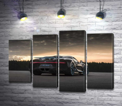 Темный силуэт черного спортивного автомобиля Bugatti Chiron