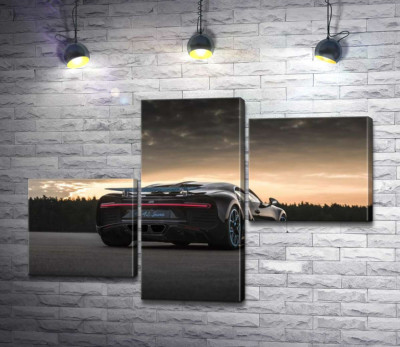 Темный силуэт черного спортивного автомобиля Bugatti Chiron